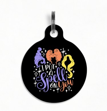 Hocus Pocus pet ID tag with the hair silhouettes of the Sanderson sisters and the words "I put a spell on you."
