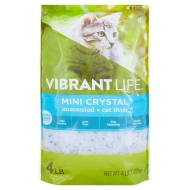 A 4-pound bag of Vibrant Life Mini Crystal Unscented Cat Litter. The crystals are ultra-fine and are mostly white with specks of blue.