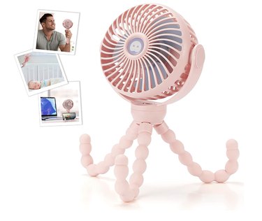 Personal fan with flexible tripod legs against a white background. It's pictured here in light pink.