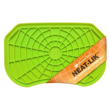 A green Neater Pets Neat-Lik Slow Feed Licking Pad for Dogs & Cats with a spiderweb texture design