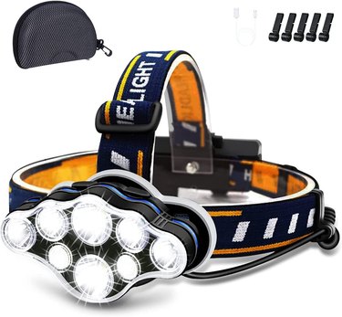 Headlamp with straps around and on top of the head with 8 LED lights, a carrying case, headlamp clips, and USB cable.