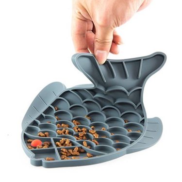 A hand holding up a Flmtop Pet Dog Cat-Slow Feeder Fish Shape Food Bowl