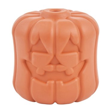 Jack-o'-lantern shaped treat dispensing toy with an opening at the top. The toy is dishwasher-safe in the top rack.