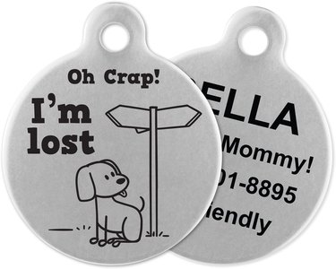 Circular stainless steel ID tags that says "Oh Crap! I'm Lost" with the image of a cartoon dog and street signs. The other side says Call My Mommy! and has contact information on it.