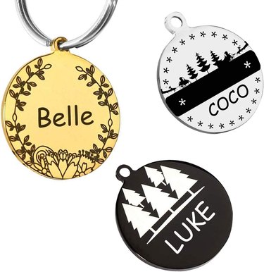 Three dog tags in gold, silver, and black with different designs on them. One is floral and the other two have trees and stars on them.