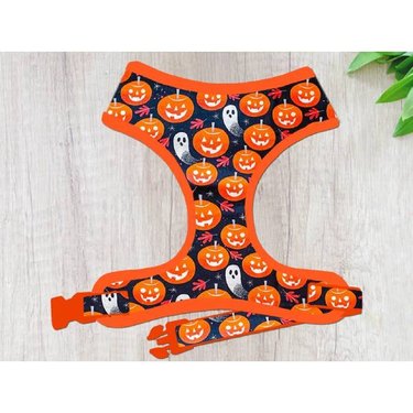 A handmade Halloween pumpkin ghost dog harness vest