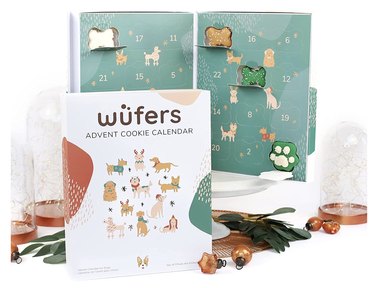 Wüfers Dog Advent Calendar showing some open windows with bone-shaped frosted and sprinkled dog treats inside.
