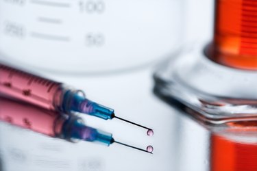 Syringe with pink liquid