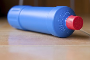 Bottle of bleach on tiled floor