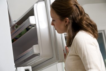 Woman looking in freezer