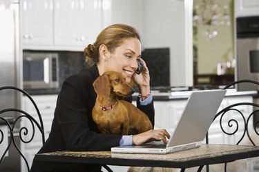 Hispanic businesswoman talking on cell phone