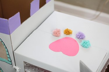 Paw print made from felt and pom-poms