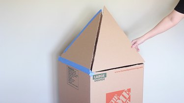 Taping triangles to top of box