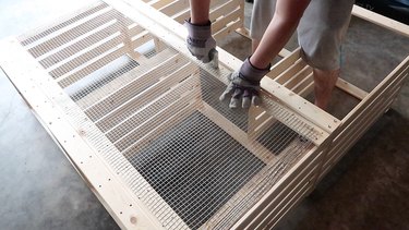 Stapling chicken wire to shelves