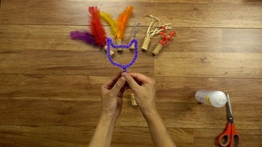 DIY cat toys out of a wine cork and pipe cleaner.