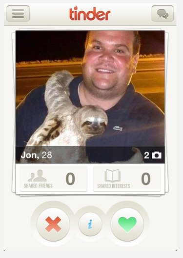 Man holds sloth in Tinder profile picture