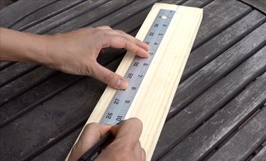 Marking planks for DIY dog puzzle feeder.