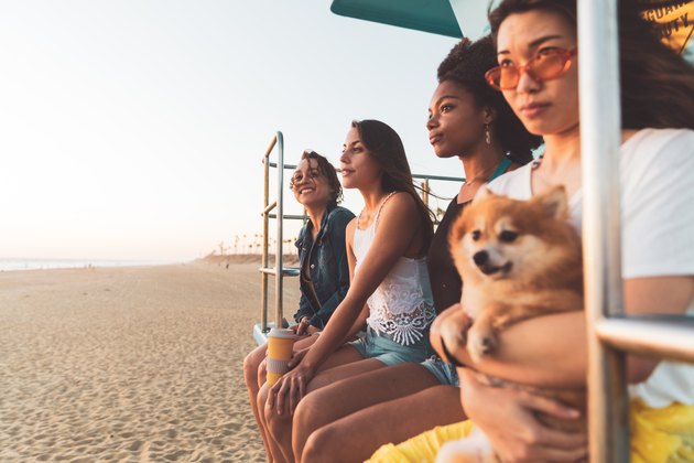 Happy young women having fun on the beach