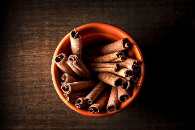 High Angle View Of Cinnamons In Bowl On Wooden Table