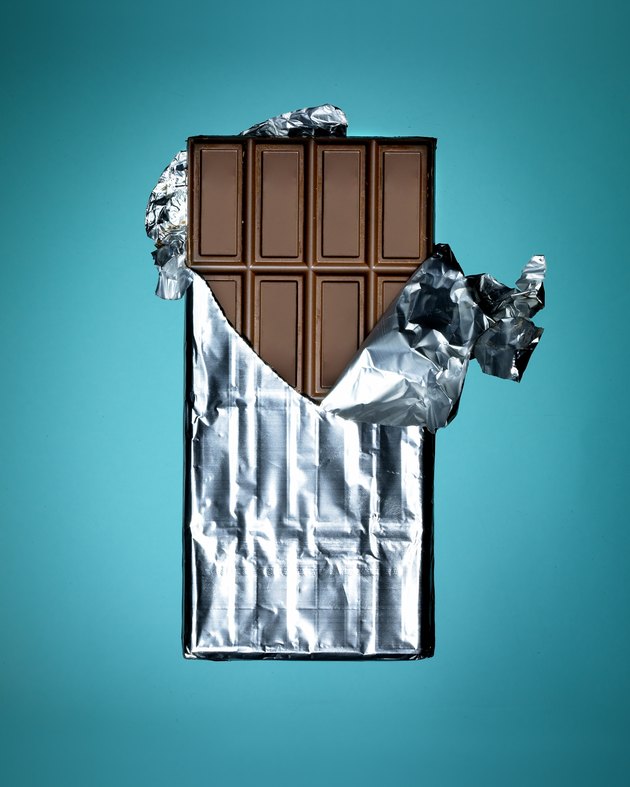 Close-up of whole chocolate bar on turquoise background