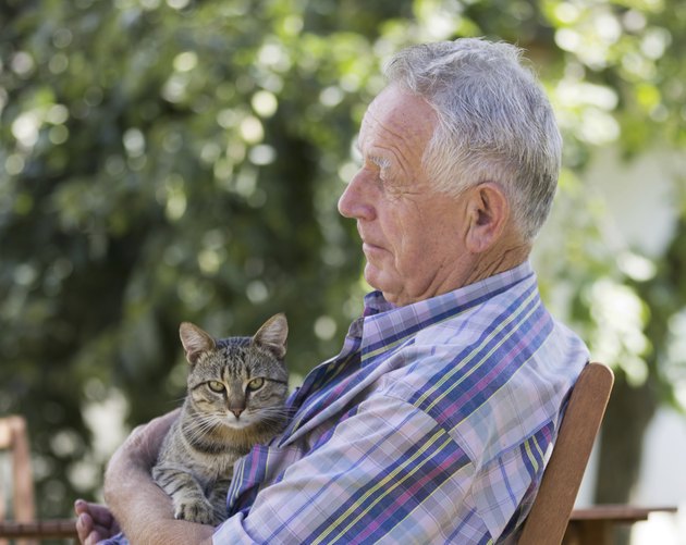 Senior man with cat