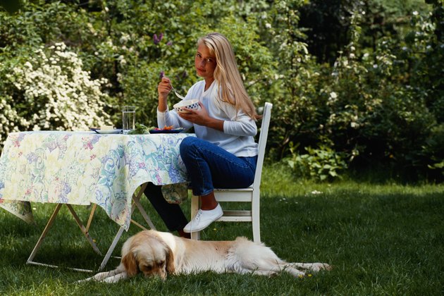 Woman eating in the garden