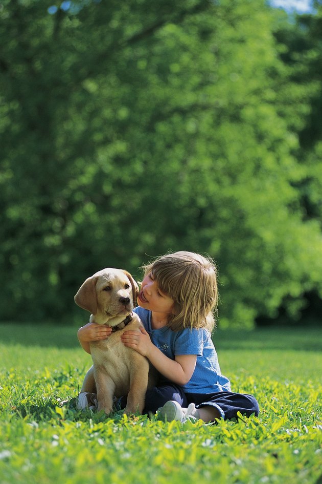 Girl with puppy , outside
