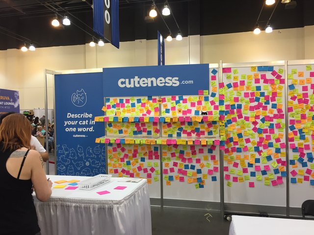 Cuteness wall covered in post-its at CatCon