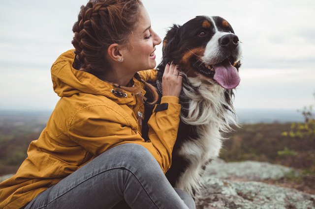Young woman with dog outdoors