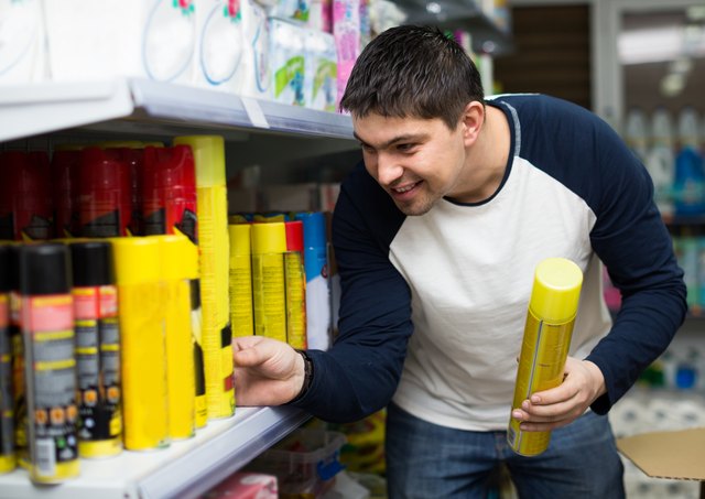 customer buying cockroach killer at the store