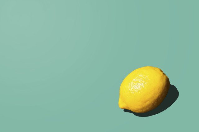 Lemon on teal background