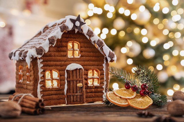 gingerbread house with christmas lights in background