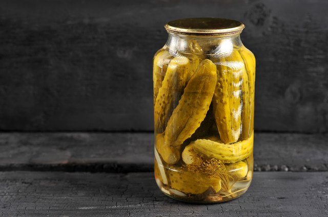 pickled homemade cucumbers in a glass jar