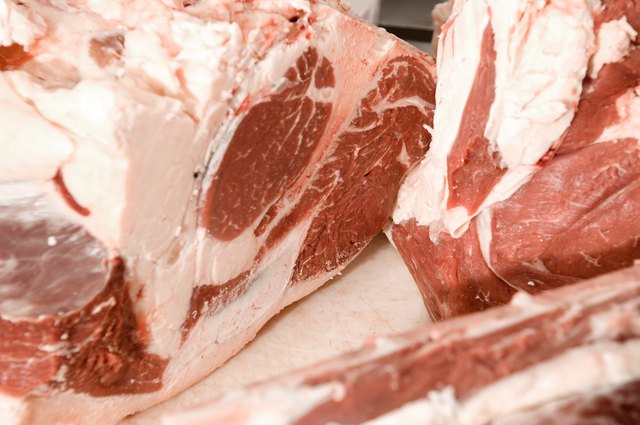 Close-up of fresh raw meat on cutting board