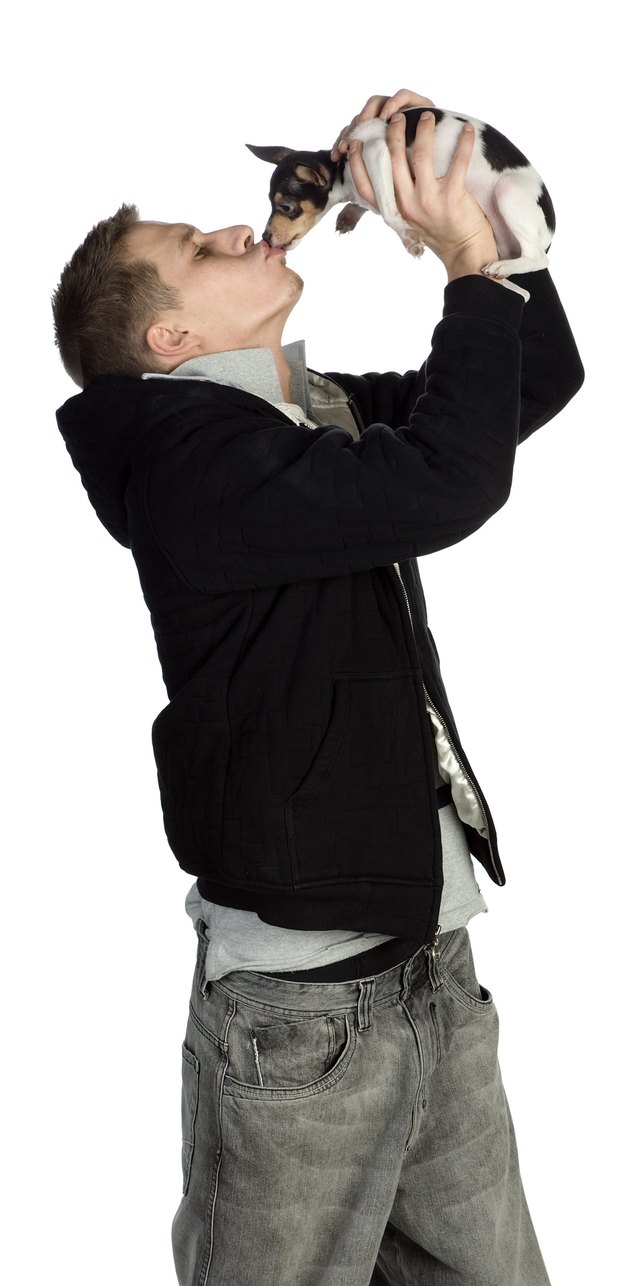 Man kissing pet dog