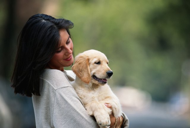 Woman holding puppy